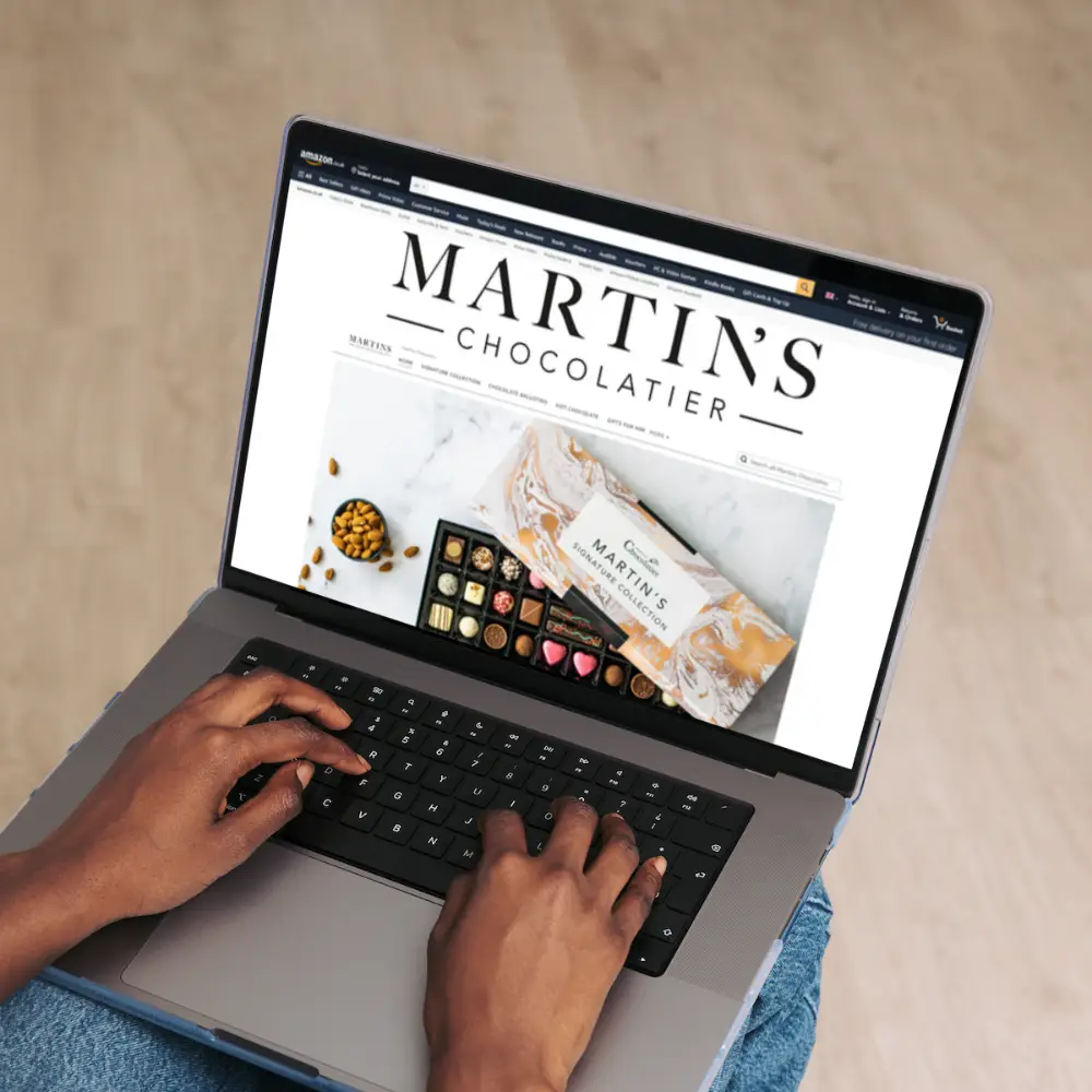 woman on laptop looking at martins chocolatier amazon brand store